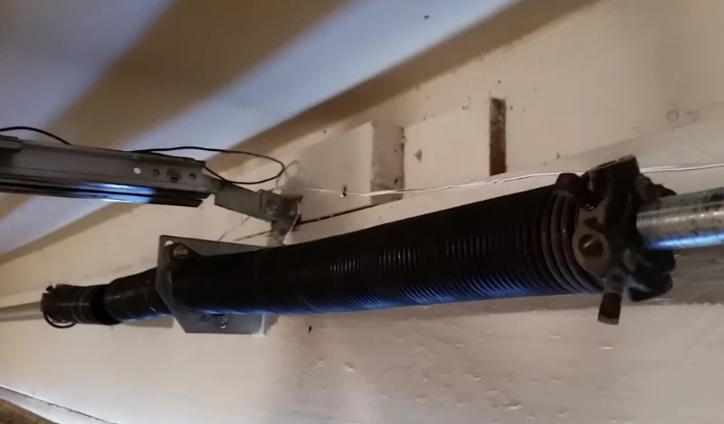 Another repaired torsion spring, built for durability and a longer service life compared to standard springs.